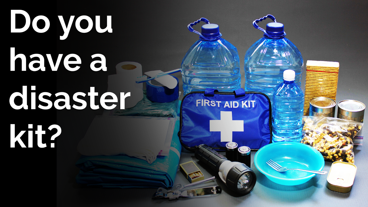 items in a disaster kit, including water, first aid kit, and flashlight