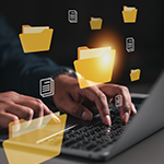 Hands on a laptop keyboard