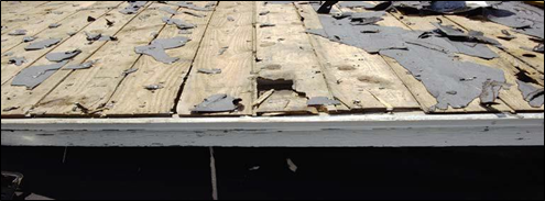 Older deteriorated and damaged board decking.
