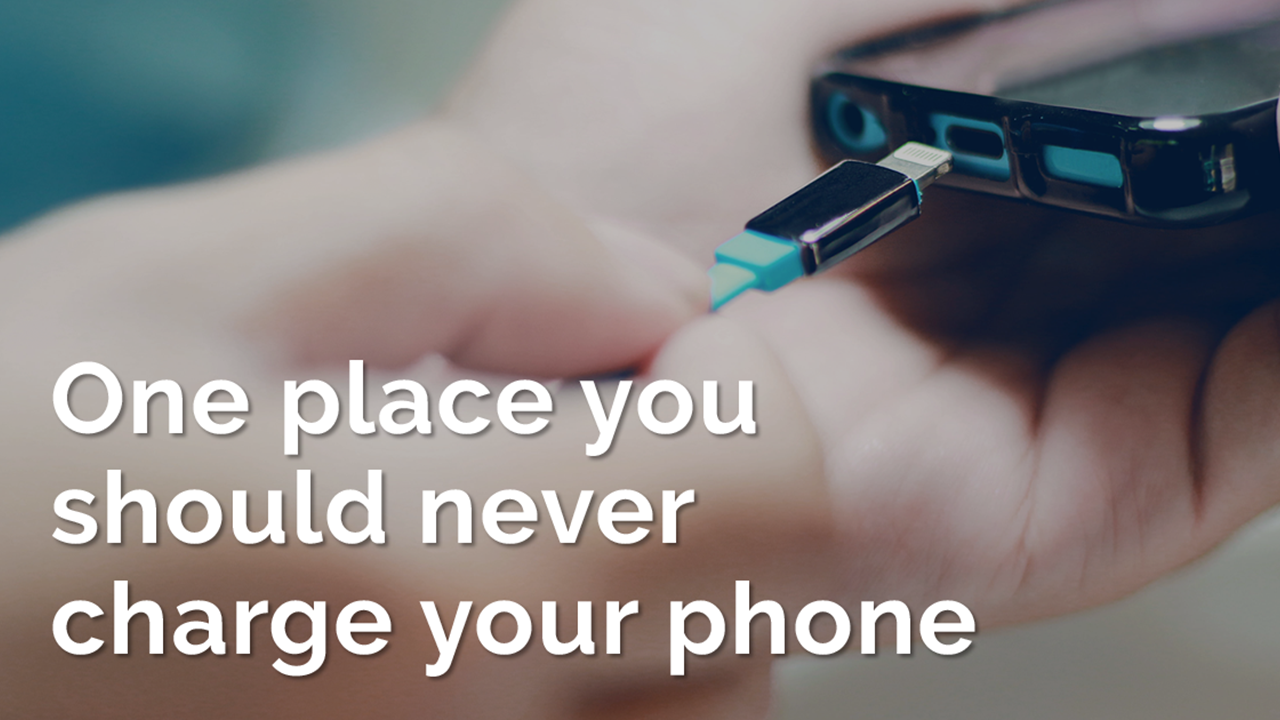 Smaort phone being plugged in. Text on image: One place you should never charge your phone