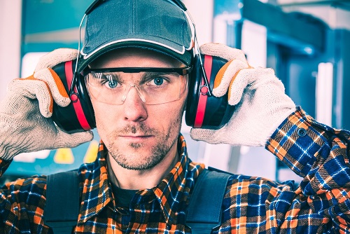 National Protect Your Hearing Month - worker with hearing protection