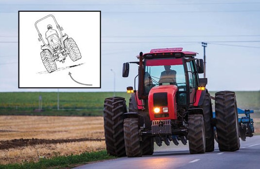 Tractor with illustration of tractor tipping sideways